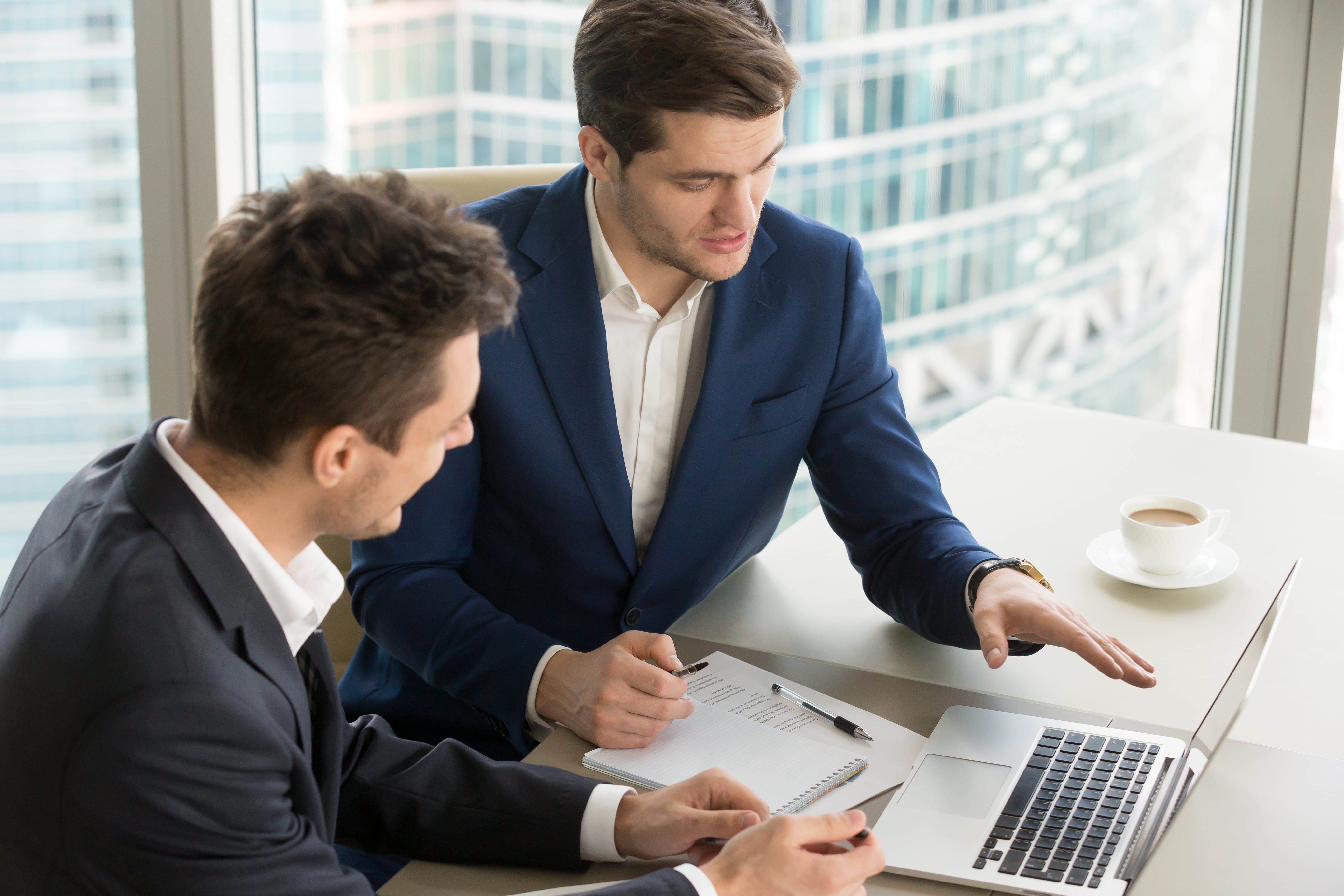 Two Mens Working on Laptop